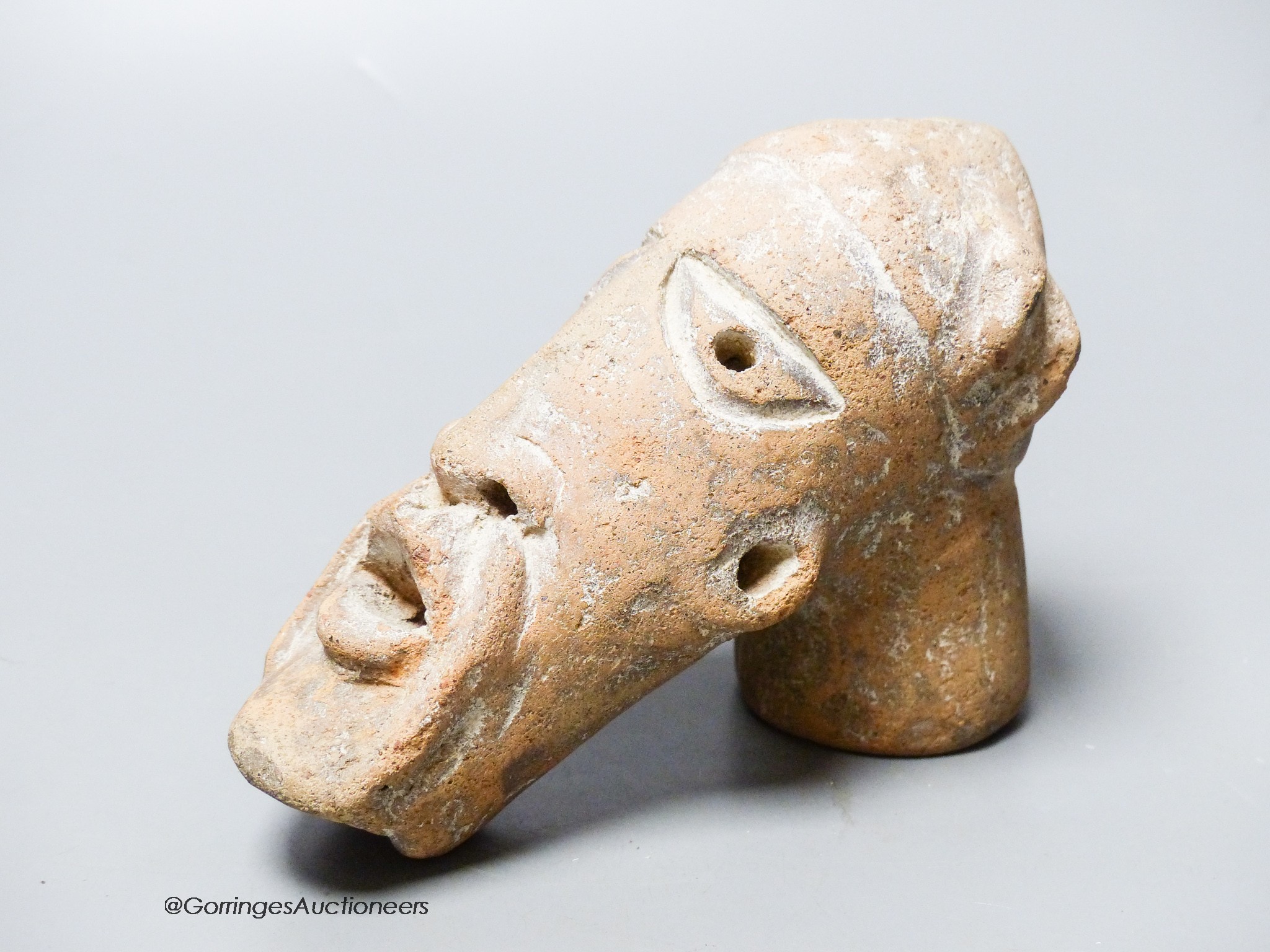 An African Tribal terracotta mask, length 16cm